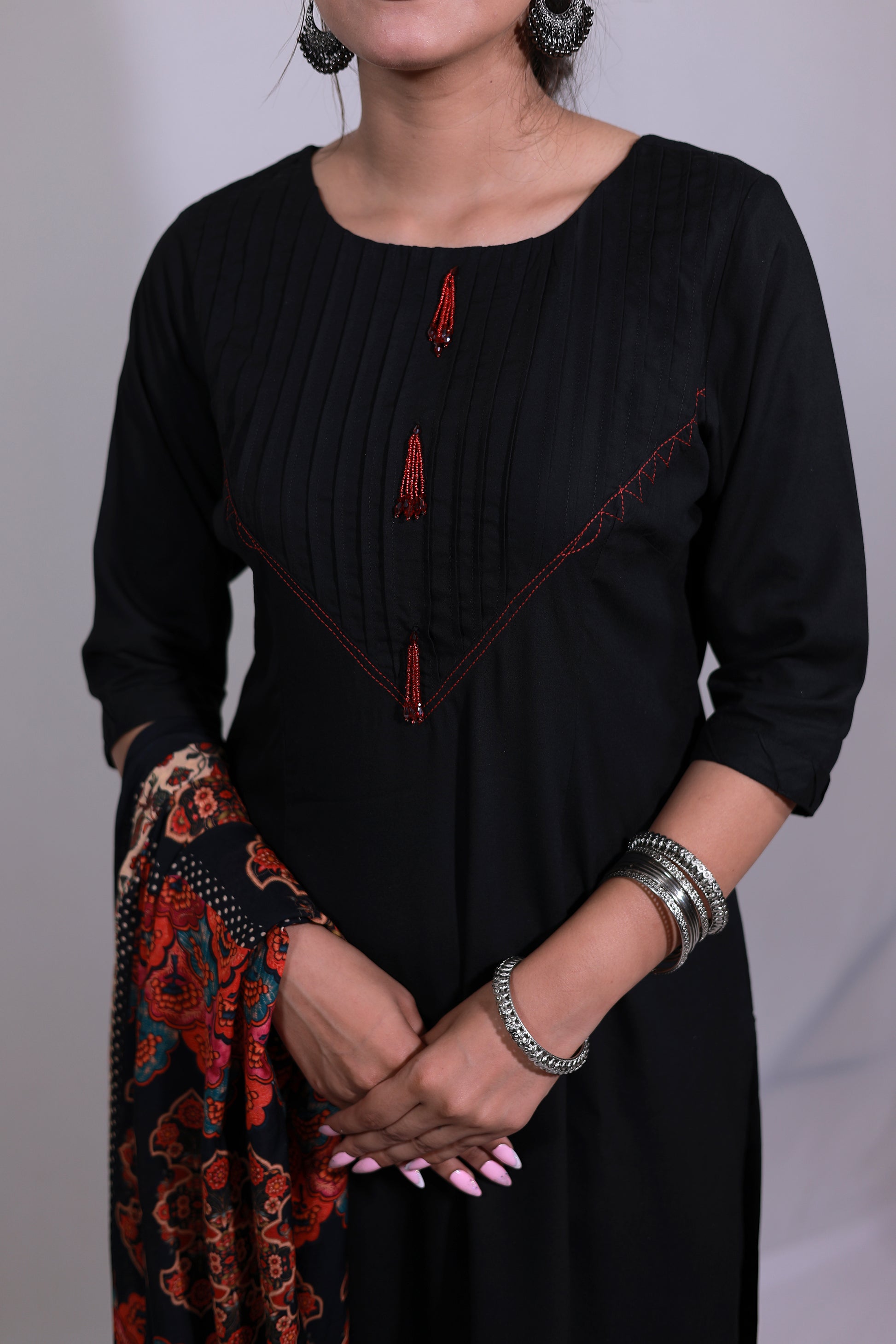 A woman in Noor-E-Nazakat black rayon kurta set with Pintuk neck & digital print dupatta, front view - Simroz