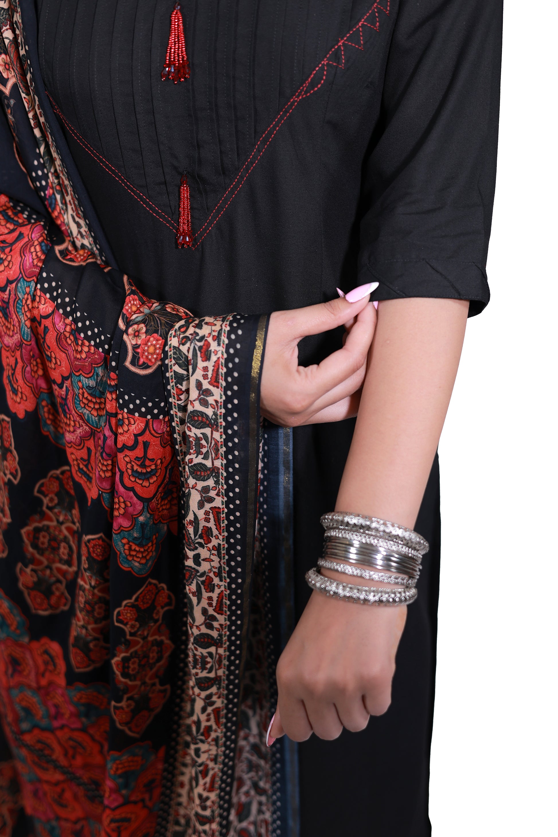 A woman standing in Noor-E-Nazakat black rayon kurta set with Pintuk neck & digital print dupatta by Simroz, close-up view, 3/4 sleeve style.