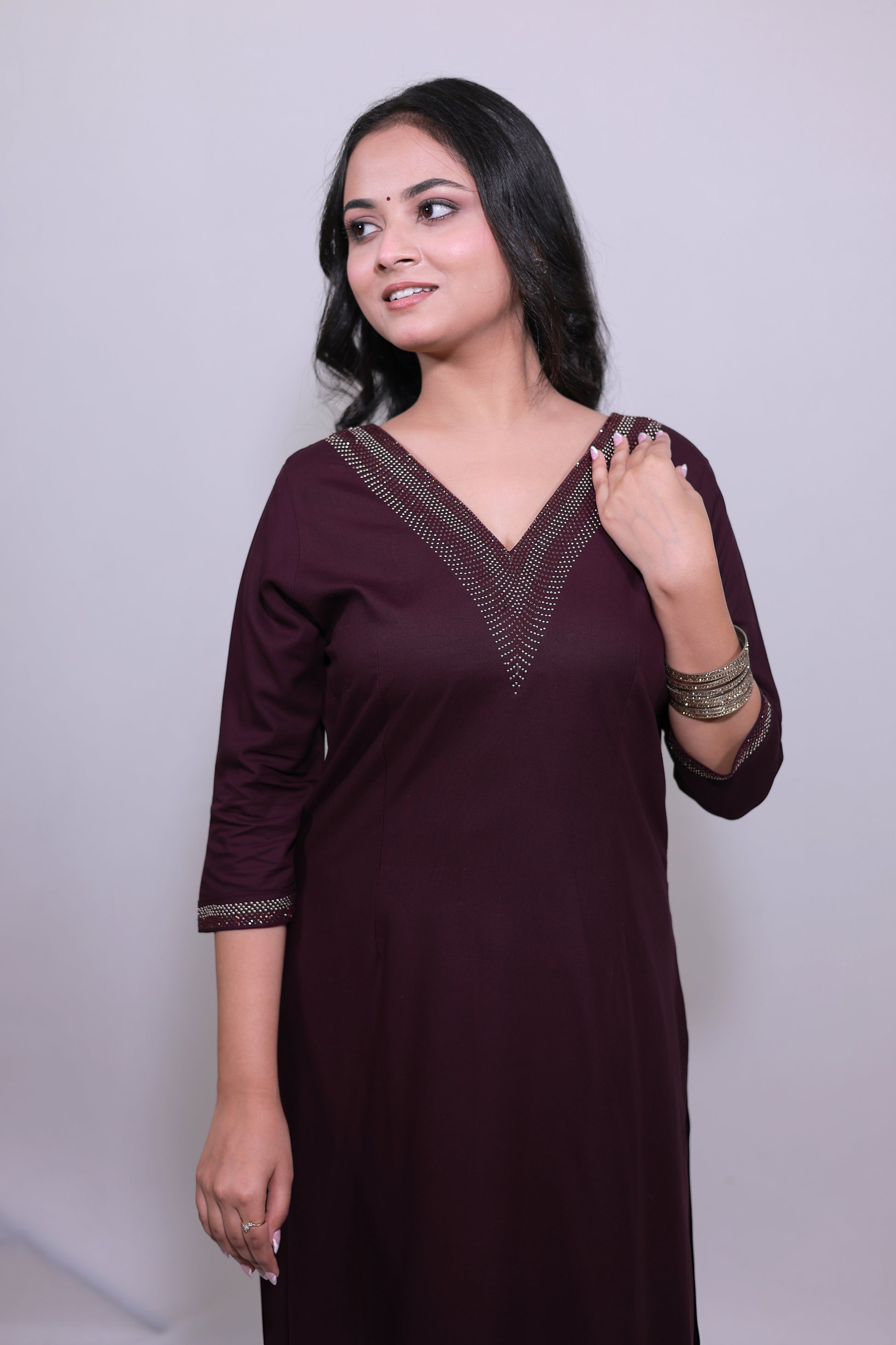 Woman wearing a Premium rayon kurta set with Swarovski shine – Surayya by Simroz