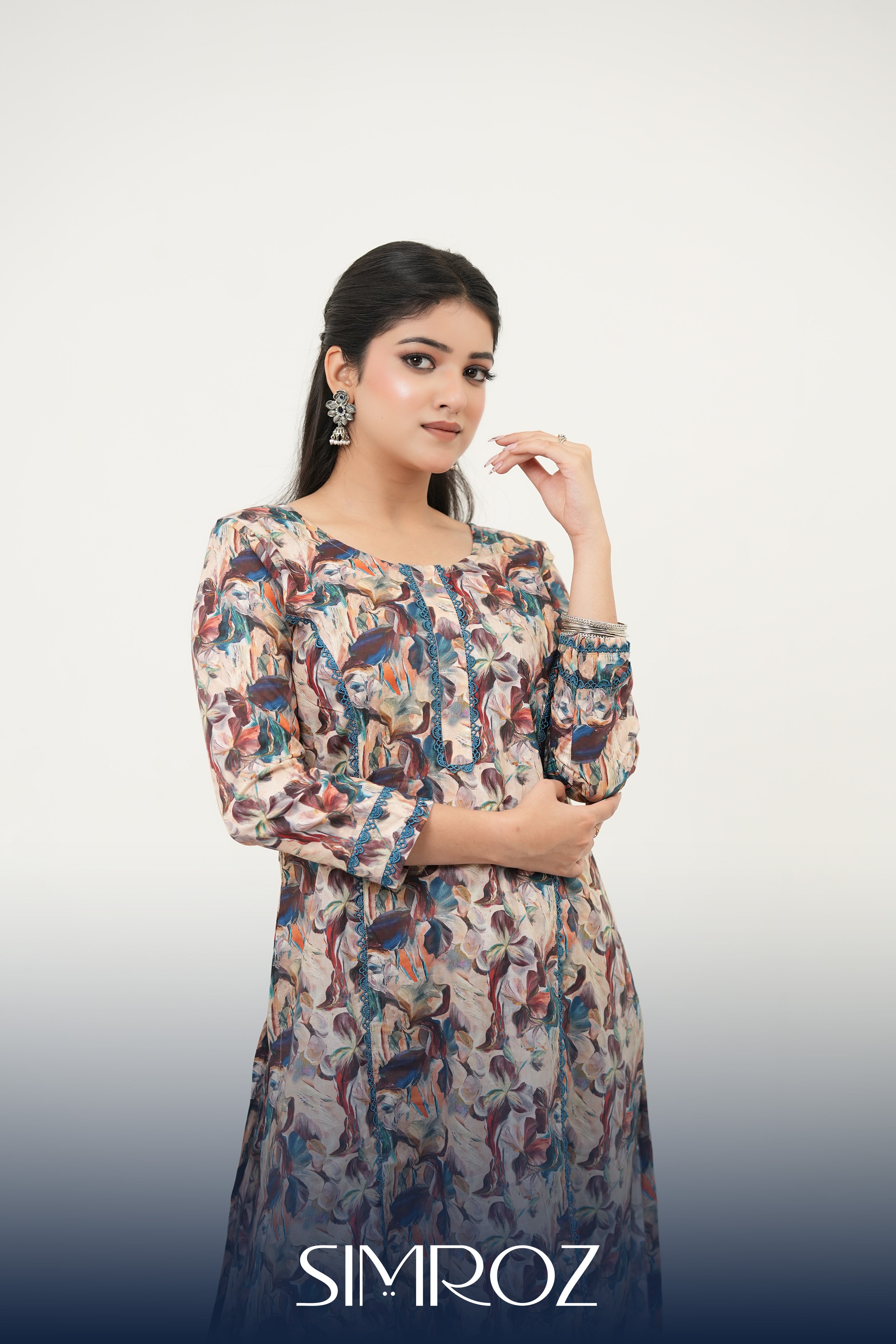 Abstract digital print kurta set with painterly floral motifs and delicate lacework by SIMROZ