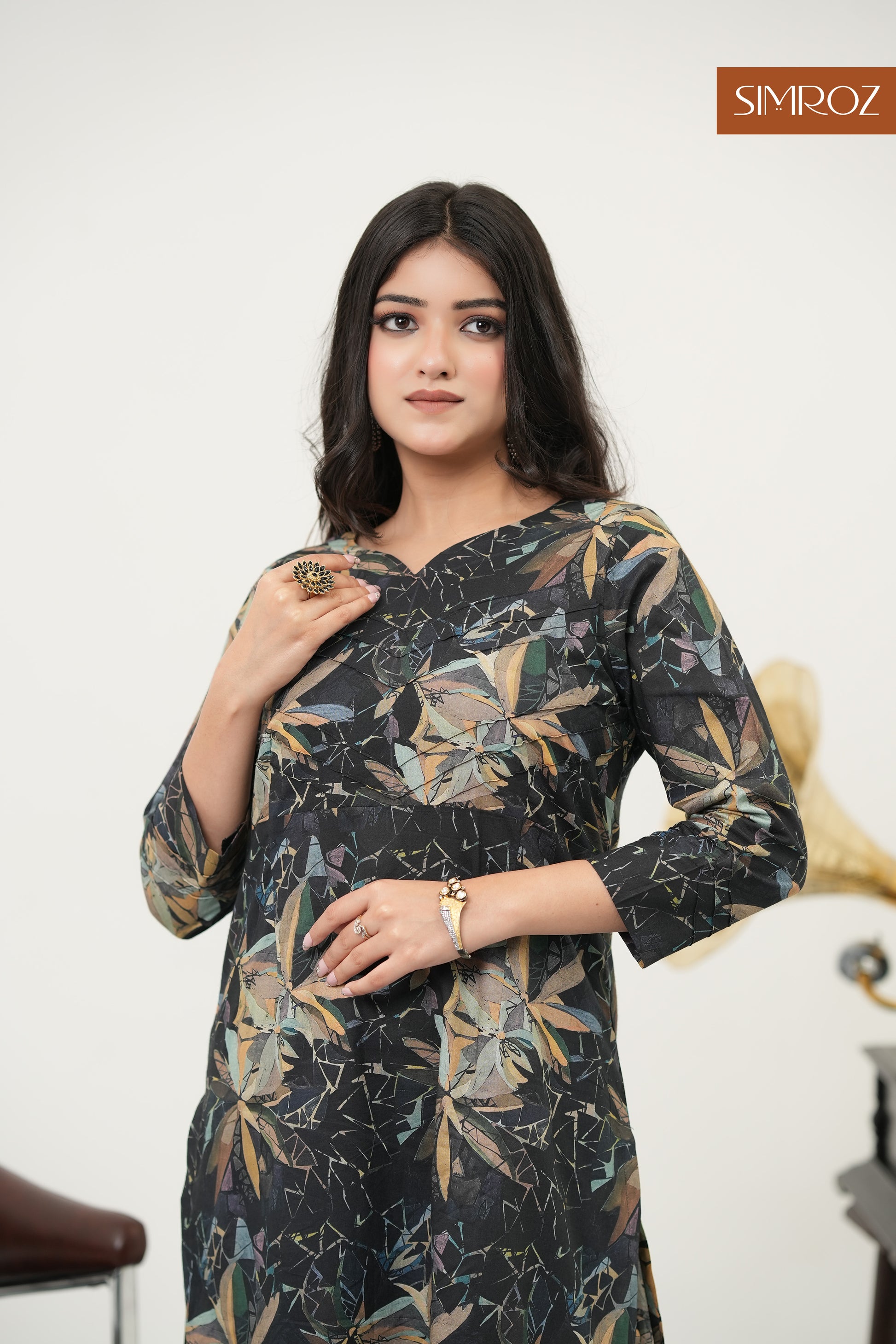 Elegant black cotton kurta set with botanical digital prints.
