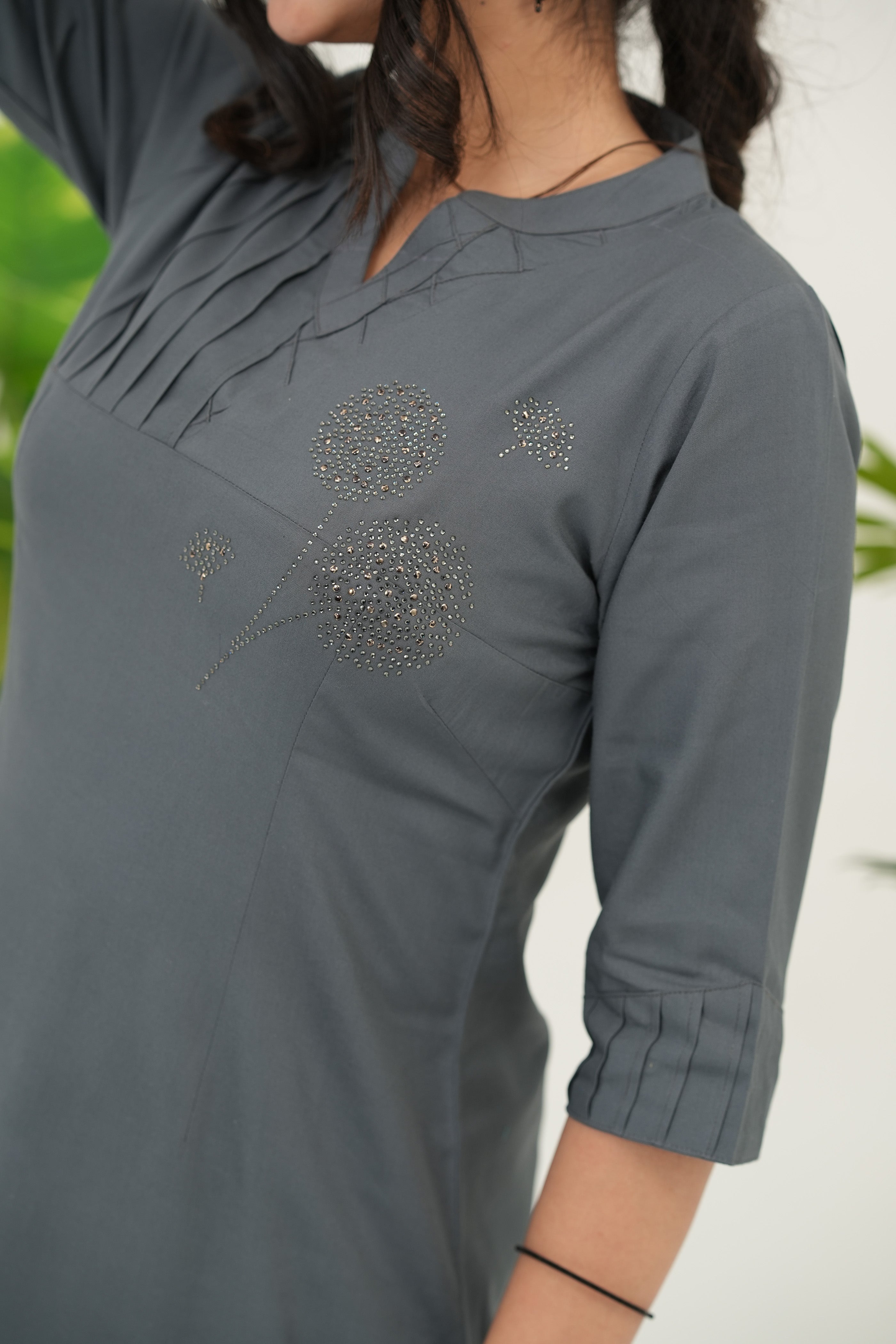 Stylish Swarovski embellished grey kurta set for women in soft rayon viscose, straight cut, and pleated neckline, close-up view - Simroz.
