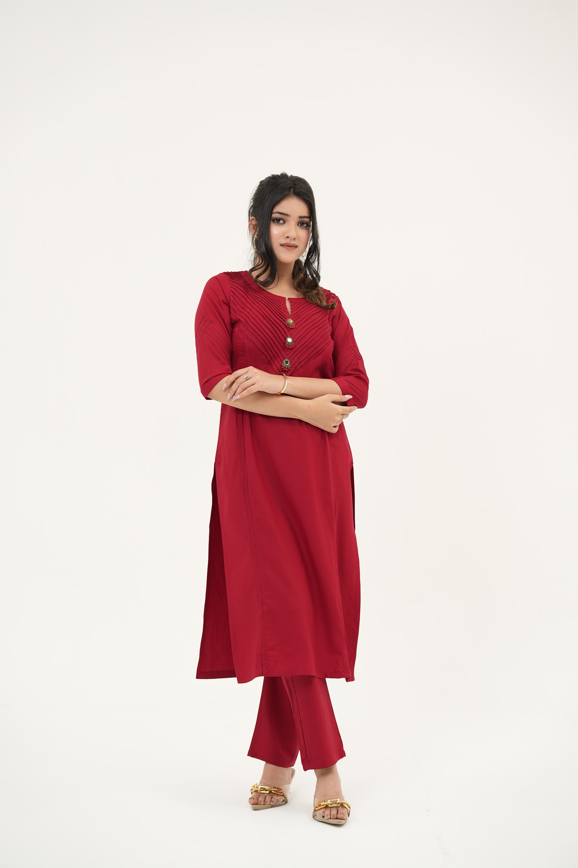 Elegant red kurta set in rayon viscose with handcrafted buttons, pleated pintuck neckline, and straight-fit silhouette - Simroz