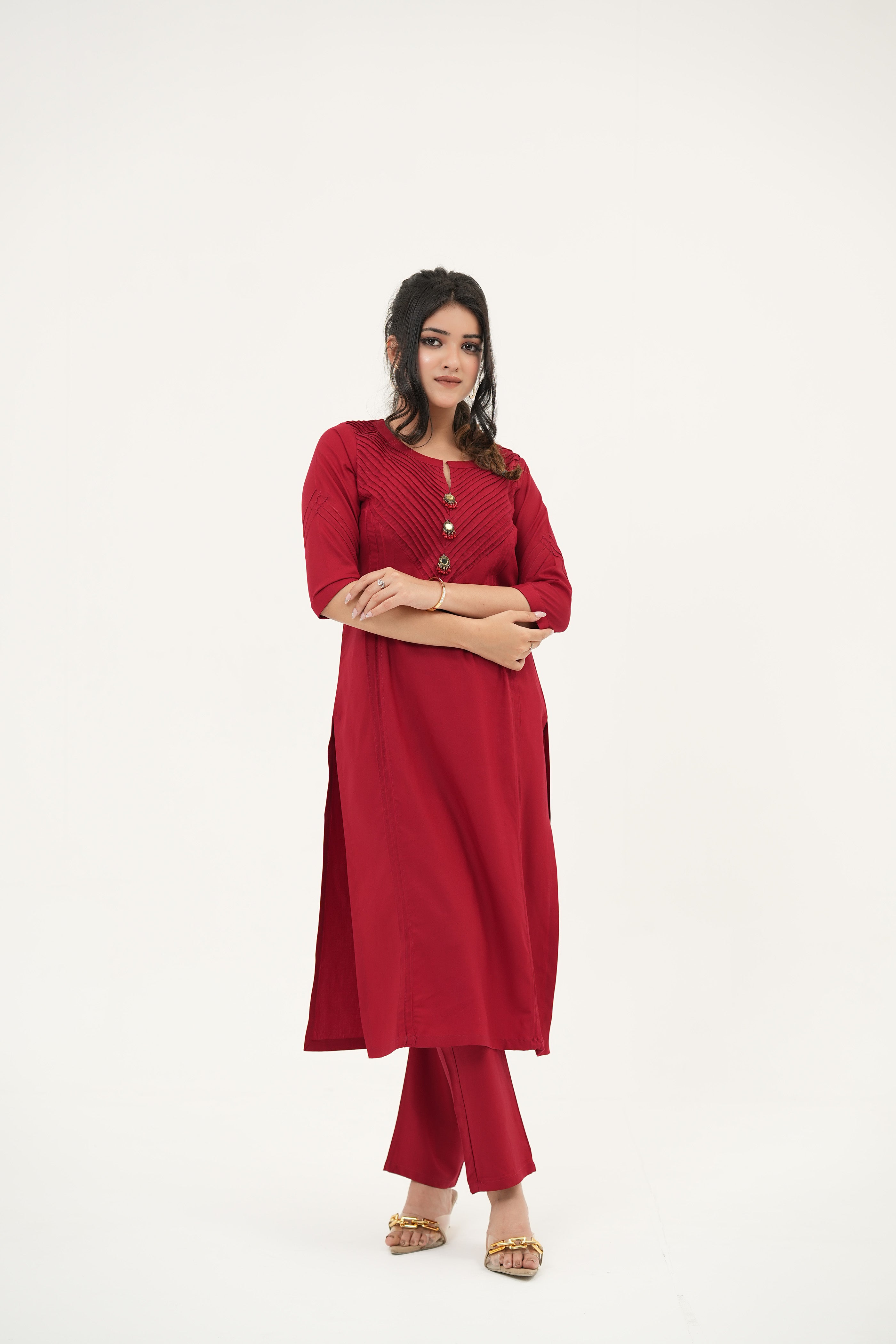 Elegant red kurta set in rayon viscose with handcrafted buttons, pleated pintuck neckline, and straight-fit silhouette - Simroz