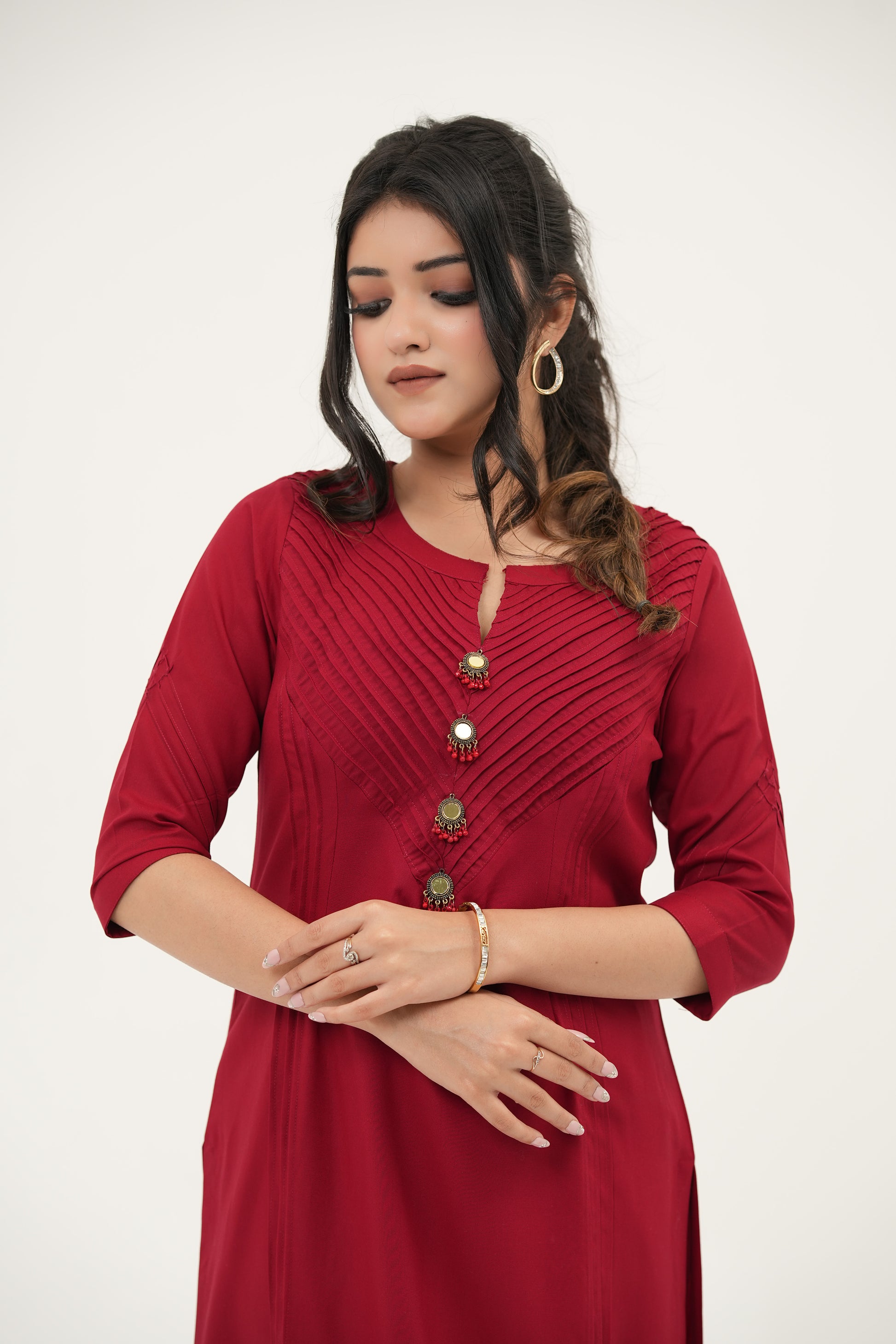 SIMROZ Crimson Radiance kurta set in bold red with elegant pintuck detailing and gold-toned mirror buttons