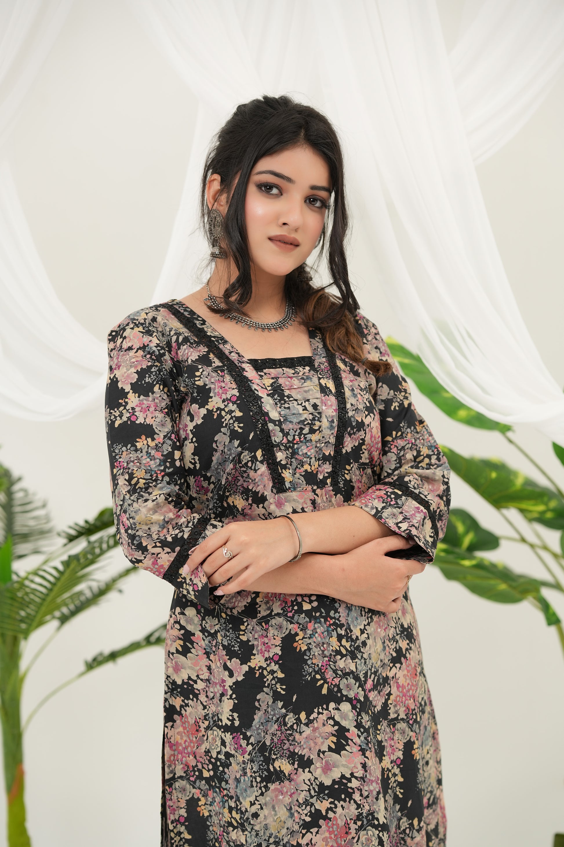 Elegant black cotton cambric kurta set featuring blush pink and peach floral motifs with lace accents - Simroz.