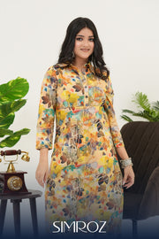 A woman wearing a Sunlit Canopy digital print kurta set with vibrant floral patterns and breathable cotton cambric fabric by SIMROZ