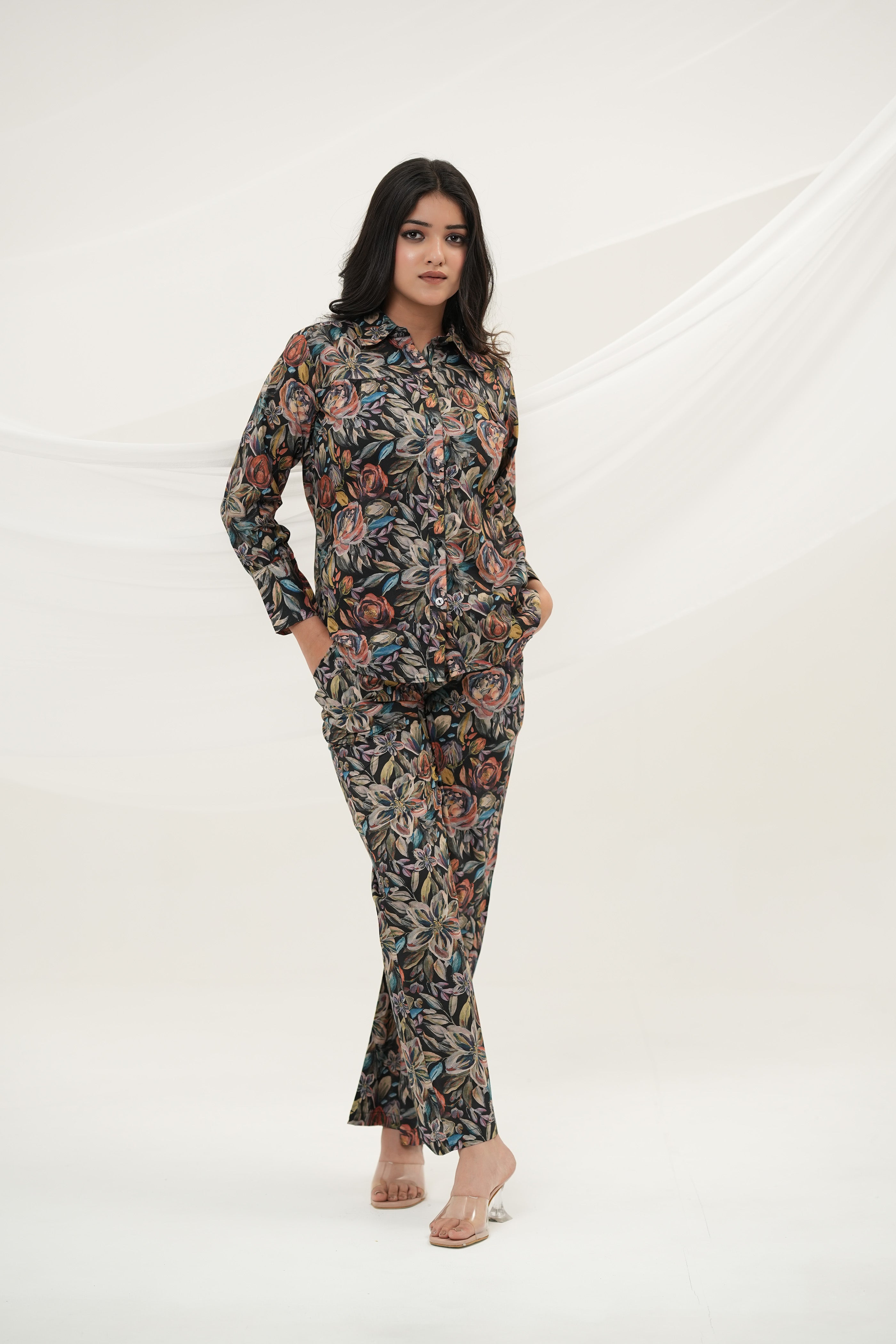 A woman wearing Black Multiflora Co-ord Set with pockets, full front view, relaxed - Simroz.
