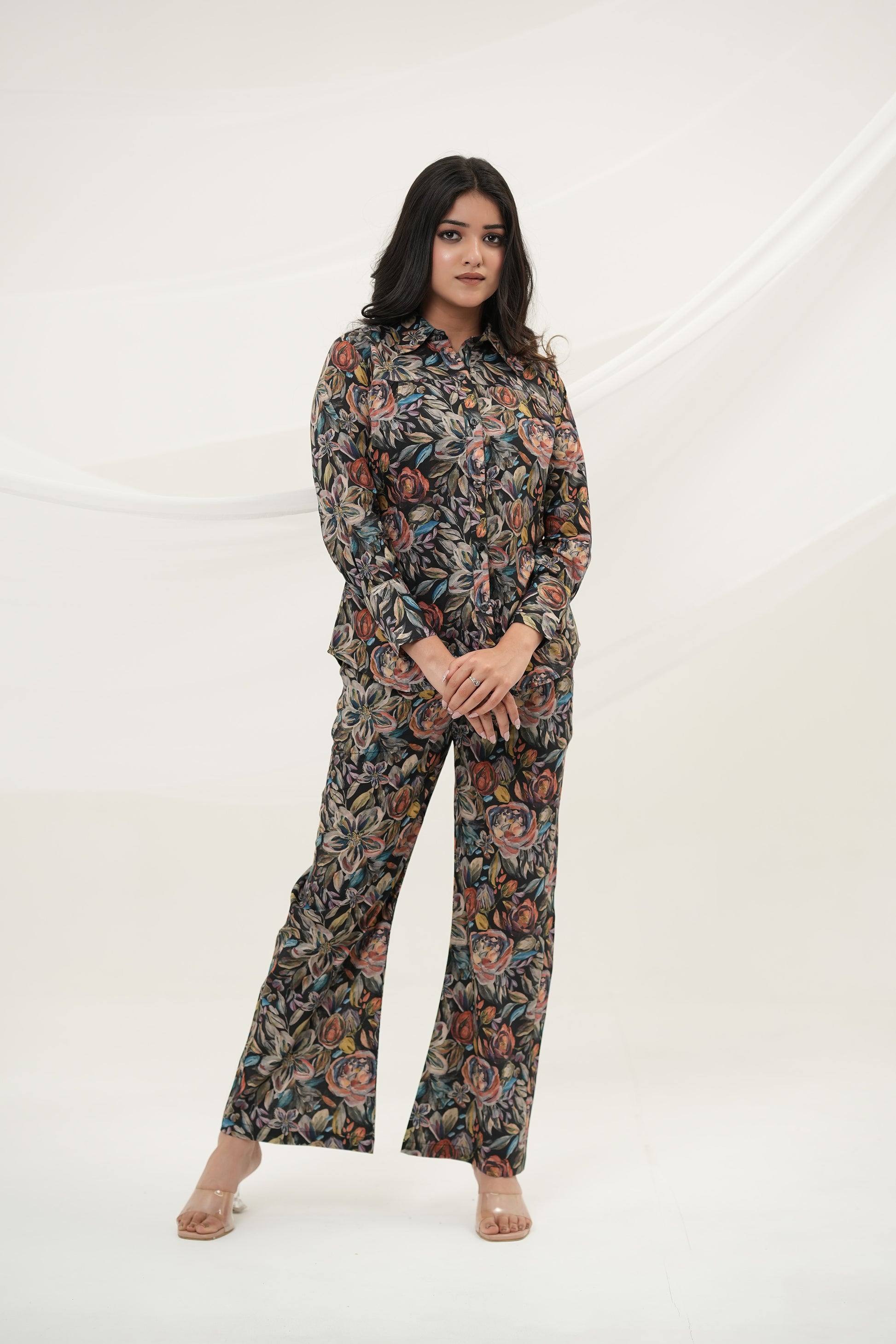 A woman wearing Black Multiflora Co-ord Set with pockets, full front view, standing - Simroz.
