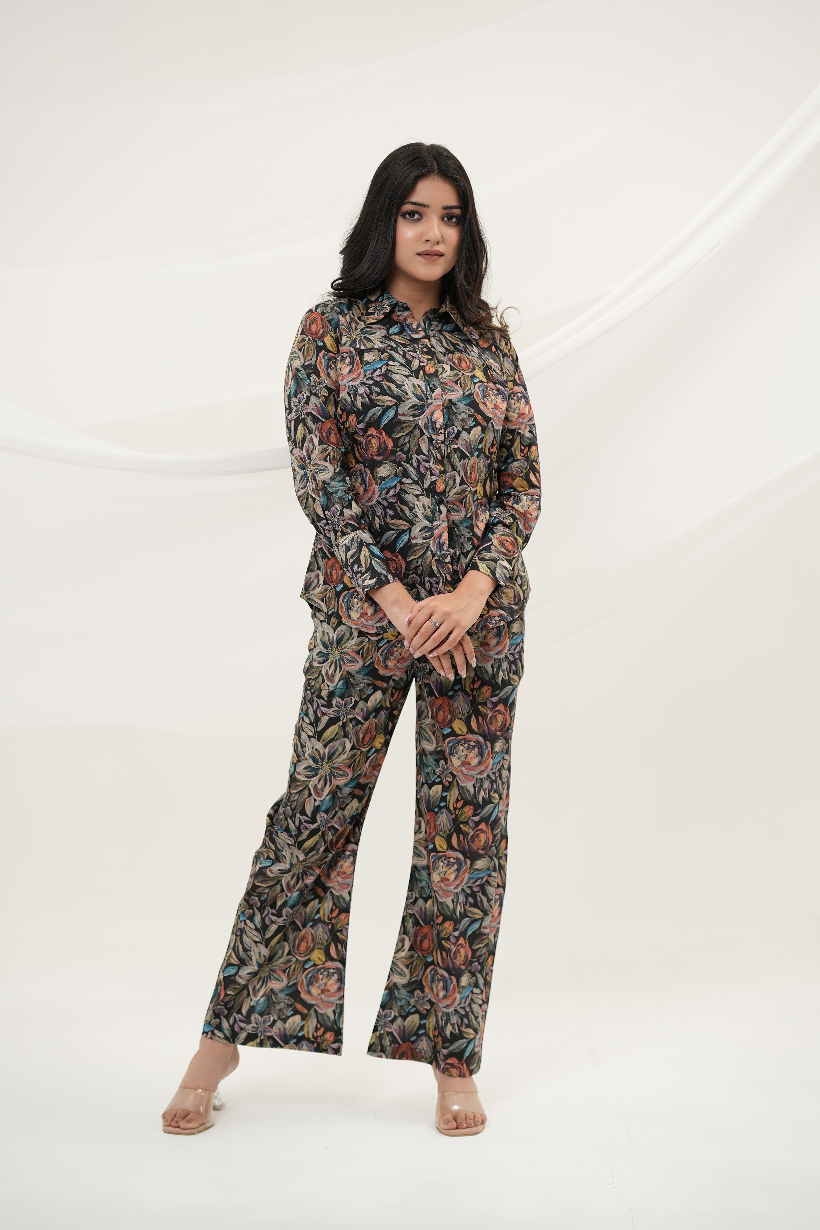 A woman wearing Black Multiflora Co-ord Set with pockets, full front view, standing - Simroz.