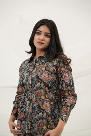 A woman wearing Black Multiflora Co-ord Set with pockets, front view - Simroz.