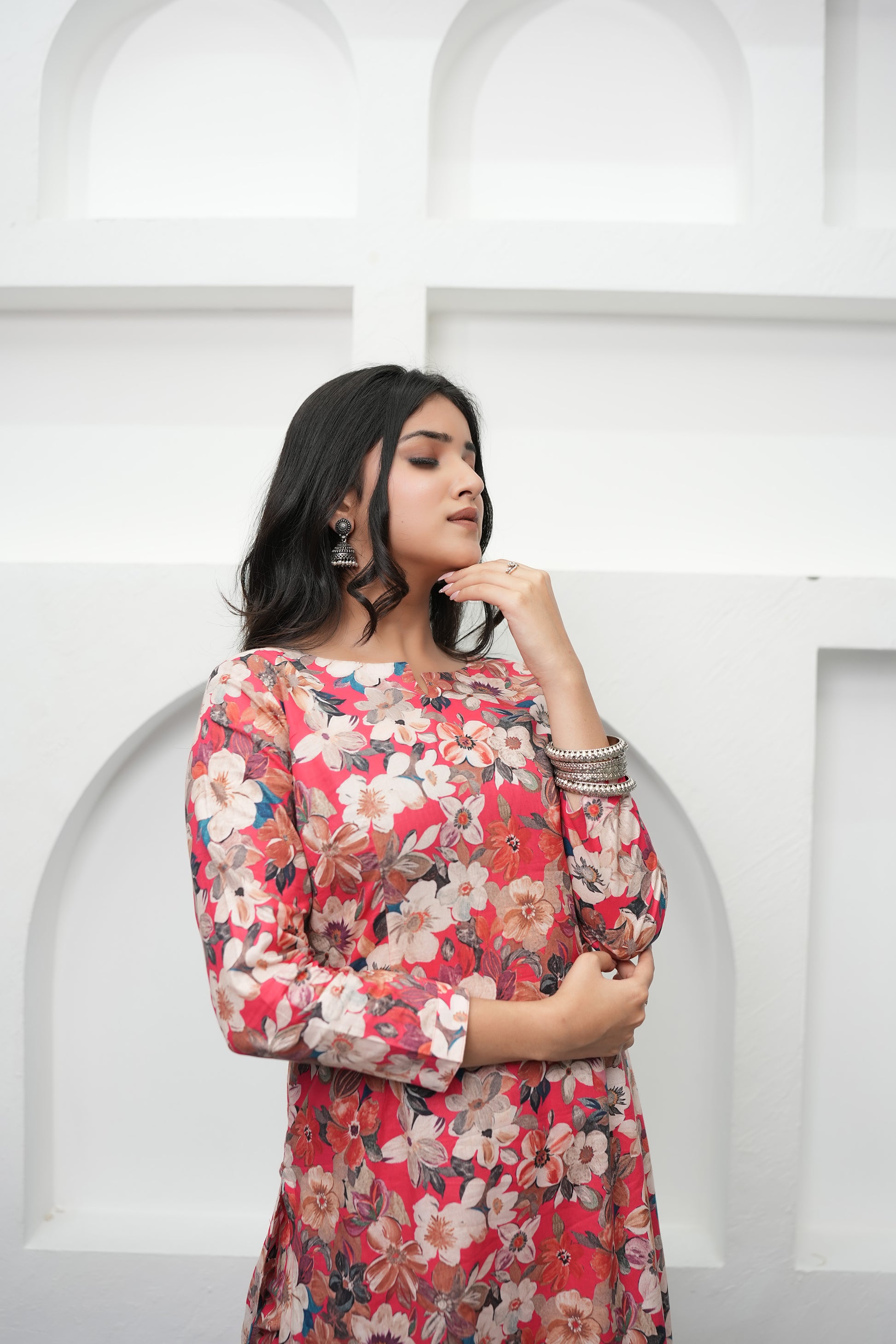 Red digital print kurta set for women with straight-fit silhouette, 3/4 sleeves, and premium cotton comfort.