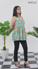 Short video clip of a model posing in Aqua Breeze Tie-Shoulder Top for women, teal blue cotton cambric fabric, gathered sleeveless style, vibrant tropical digital print, captured from multiple camera angles for a chic summer look - Simroz.