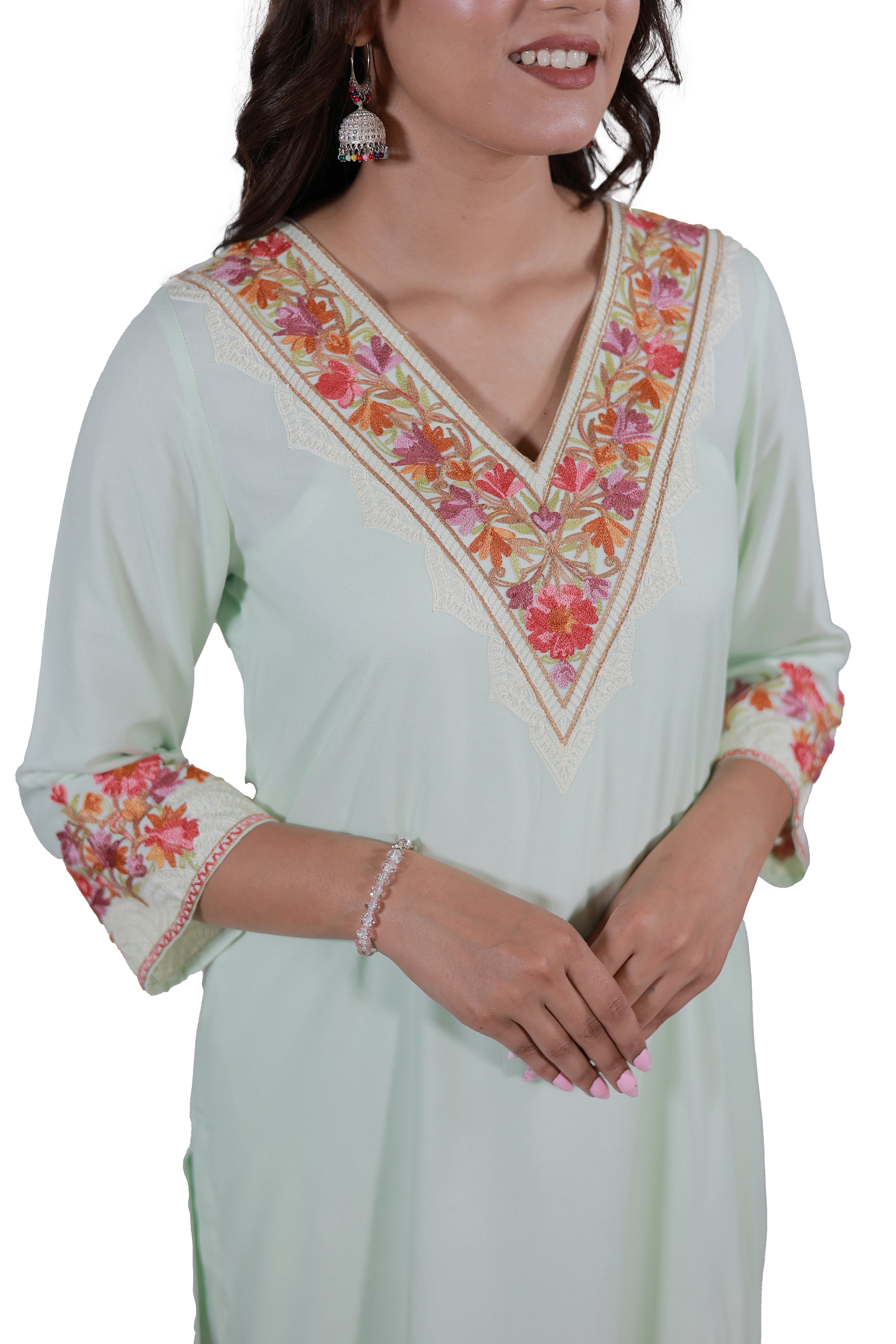 A woman wearing Simroz Bahaar-e-Gulmarg Kurta Set, Kashmiri Aari embroidery, Pastel Green – front neck view