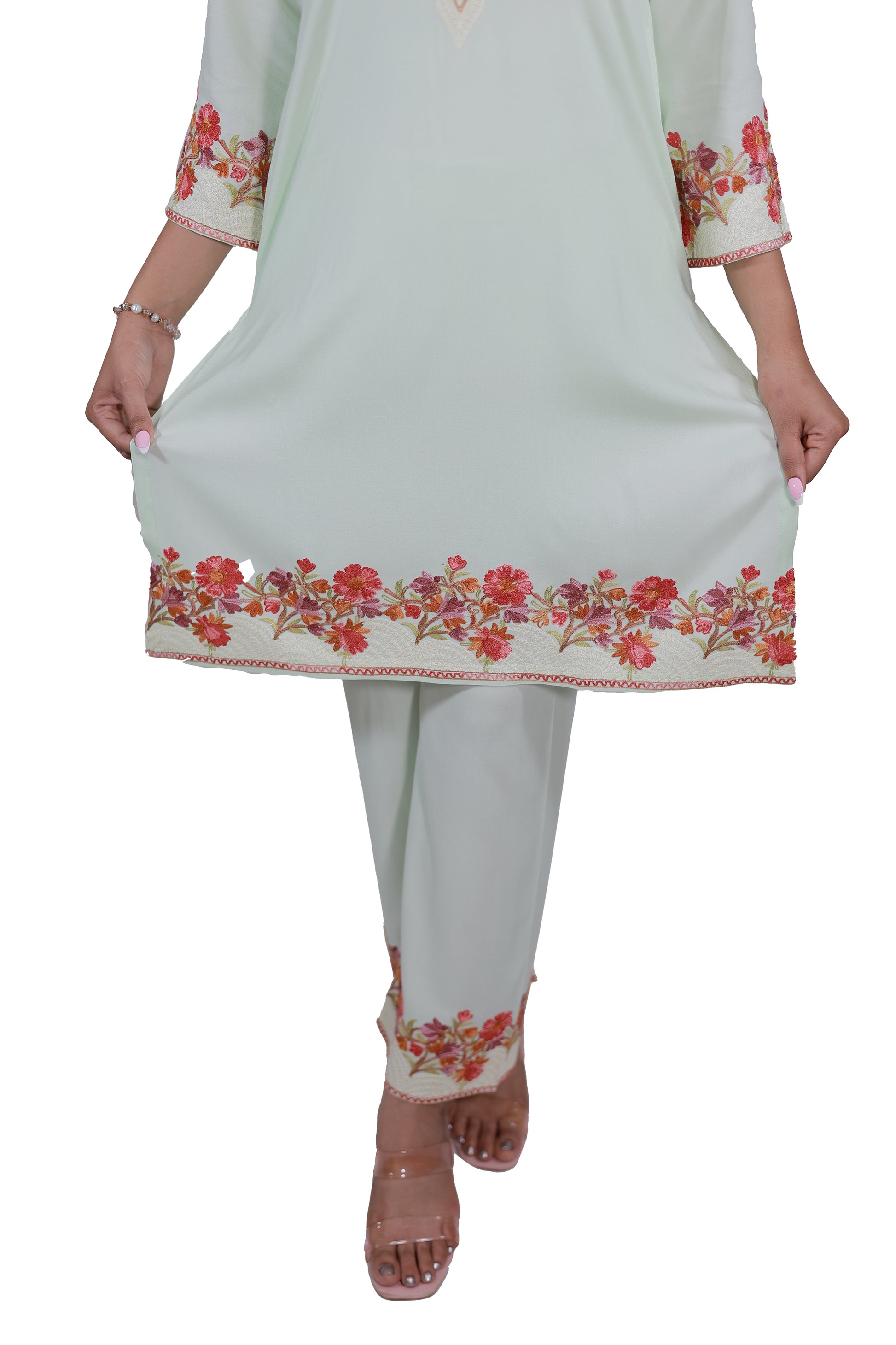 A woman wearing Simroz Bahaar-e-Gulmarg Kurta Set, Kashmiri Aari embroidery, Pastel Green – front bottom view