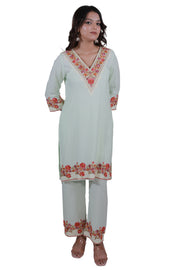 A woman wearing Simroz Bahaar-e-Gulmarg Kurta Set, Kashmiri Aari embroidery, Pastel Green – front view