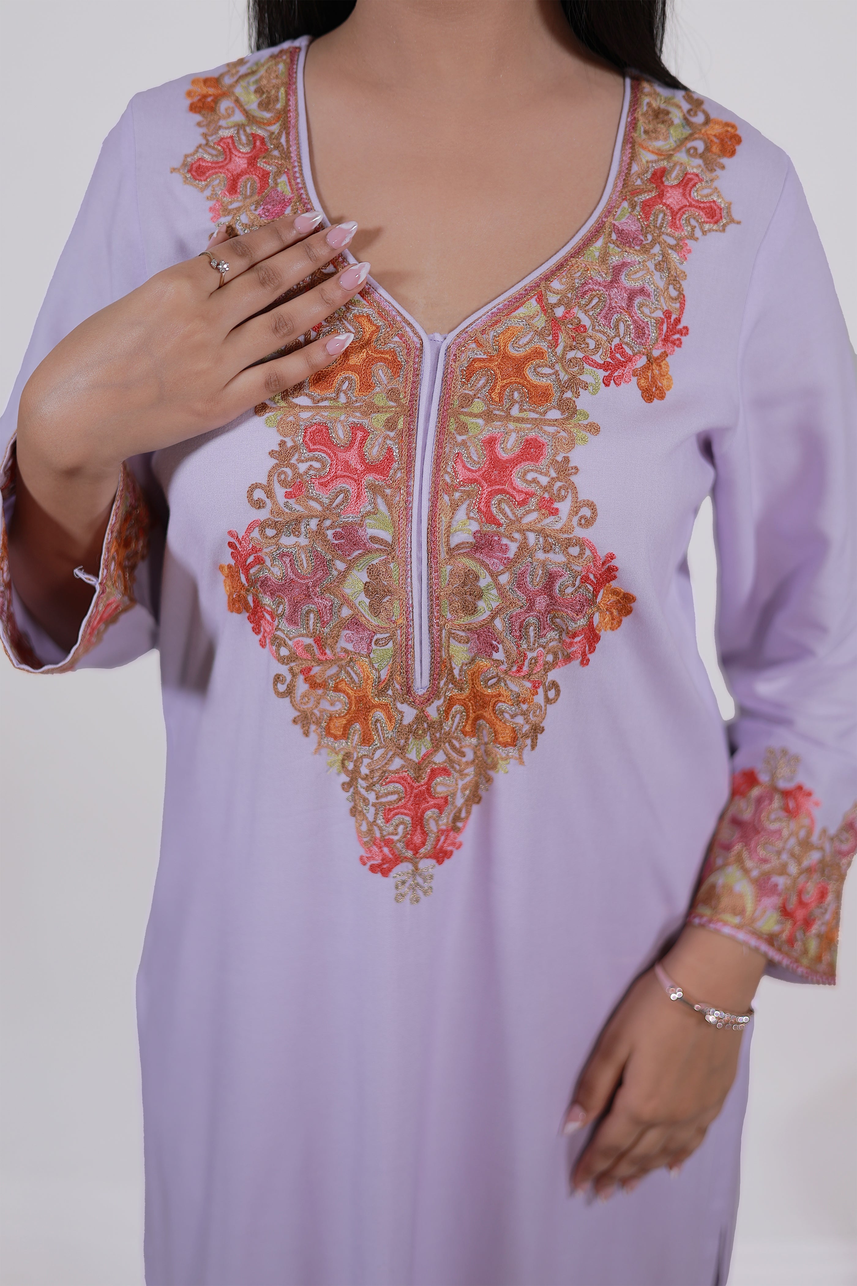 Intricate Kashmiri Aari embroidery details on Simroz Mauve Kurta Set neckline and sleeves in rayon viscose fabric