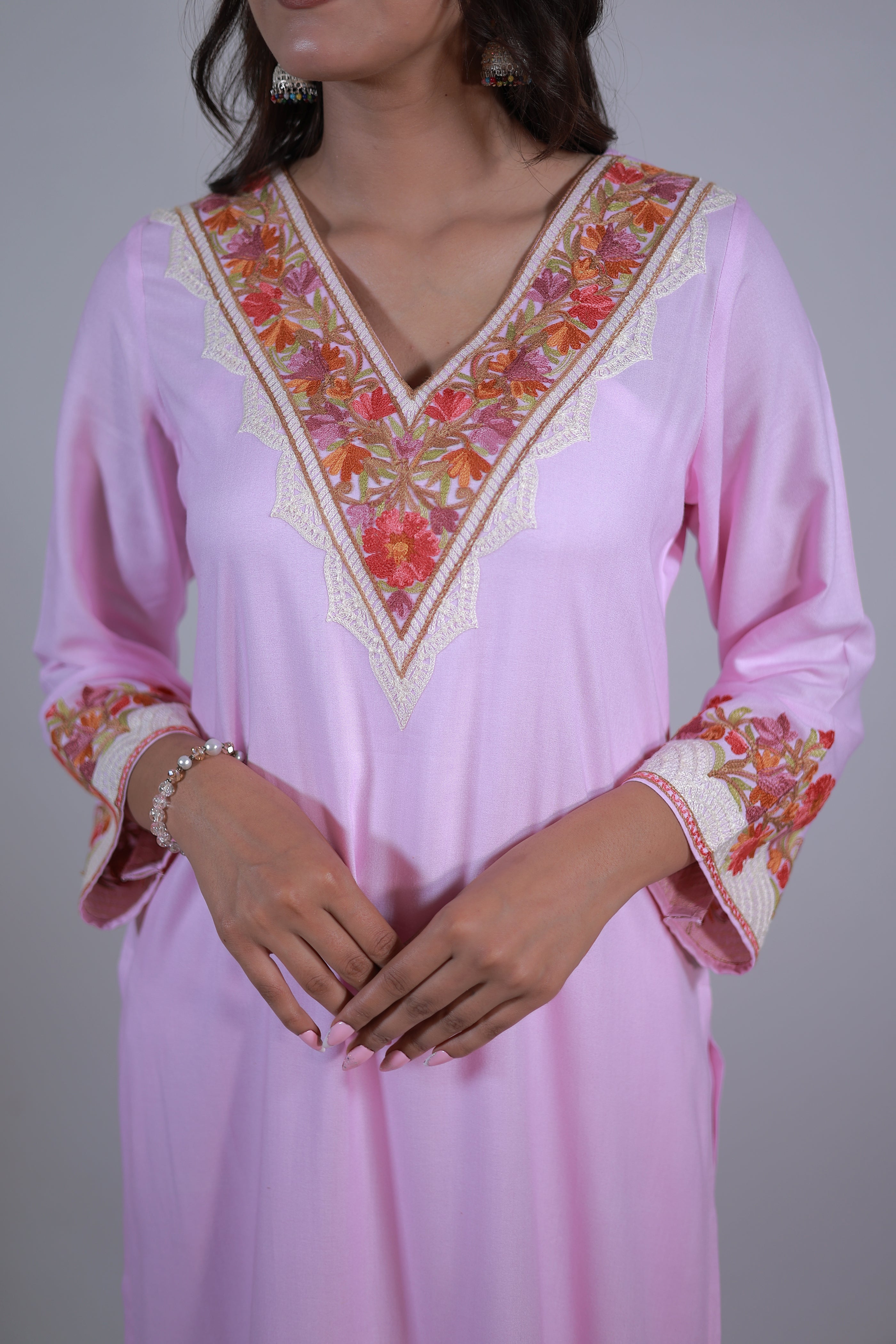 A woman wearing Simroz Bahaar-e-Gulmarg Kurta Set, Kashmiri Aari embroidery, Baby Pink – front close-up view