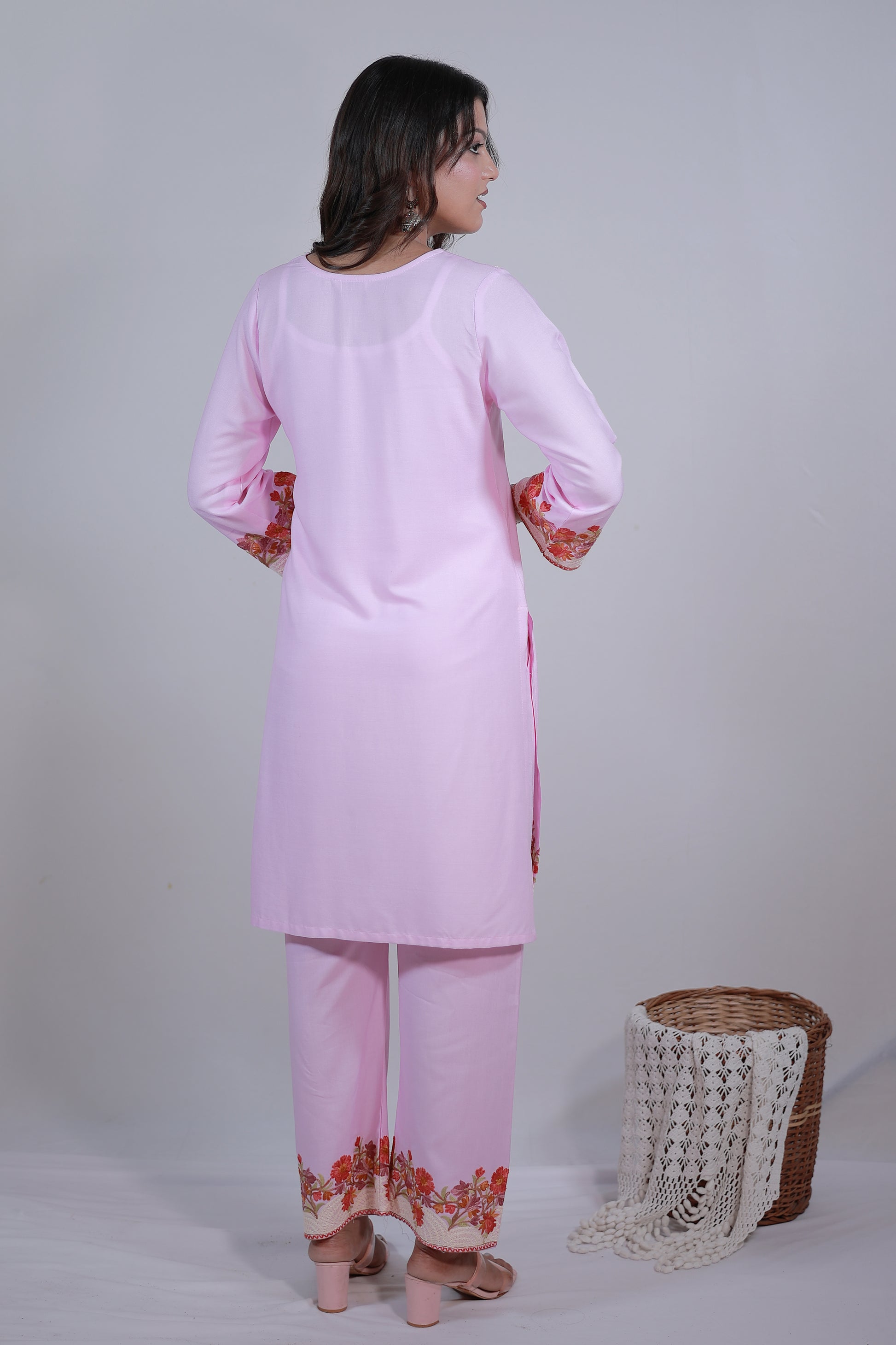A woman wearing Simroz Bahaar-e-Gulmarg Kurta Set, Kashmiri Aari embroidery, Baby Pink – back view