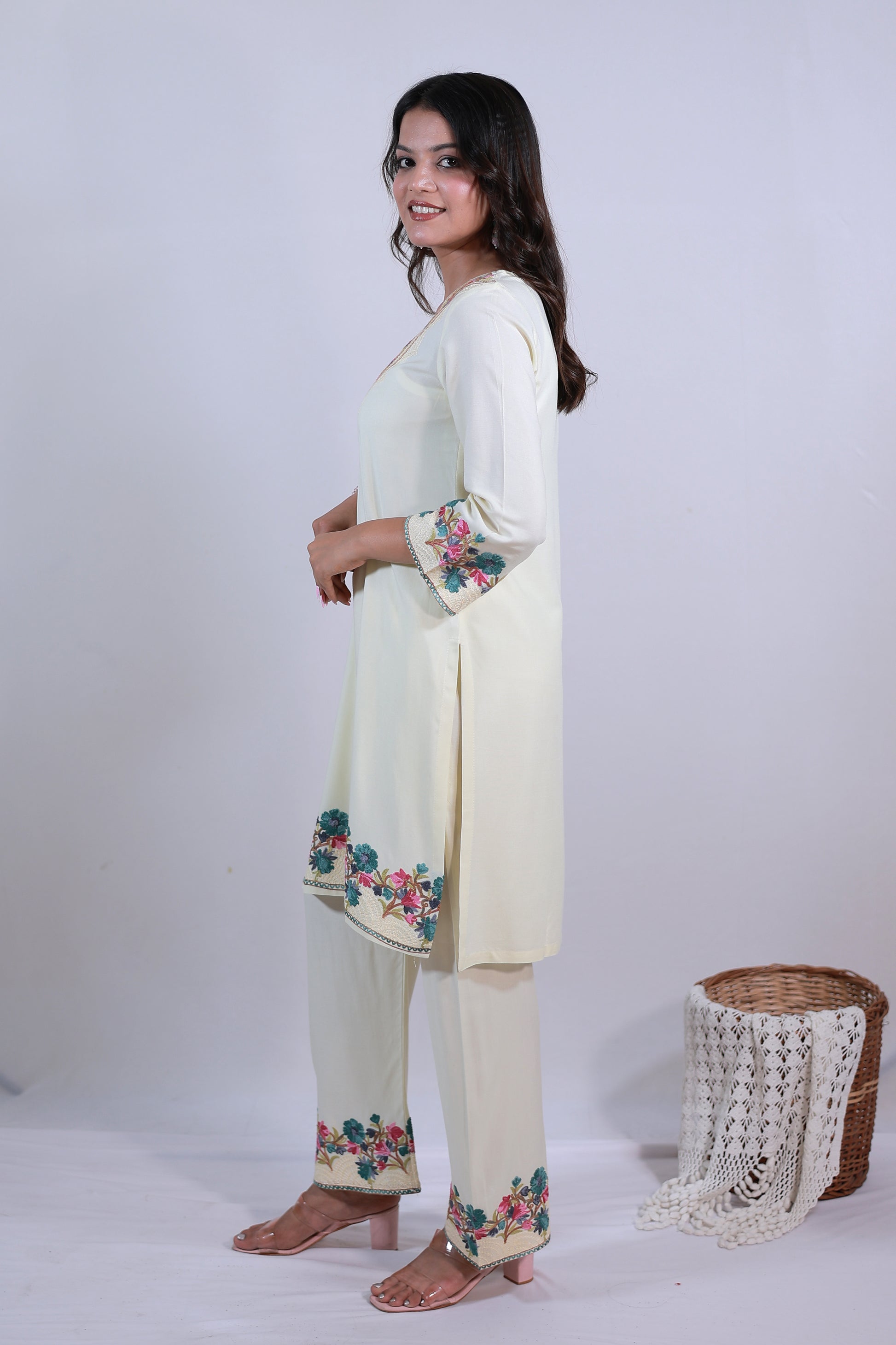 A woman wearing Simroz Bahaar-e-Gulmarg Kurta Set, Kashmiri Aari embroidery, Pastel Yellow – side view