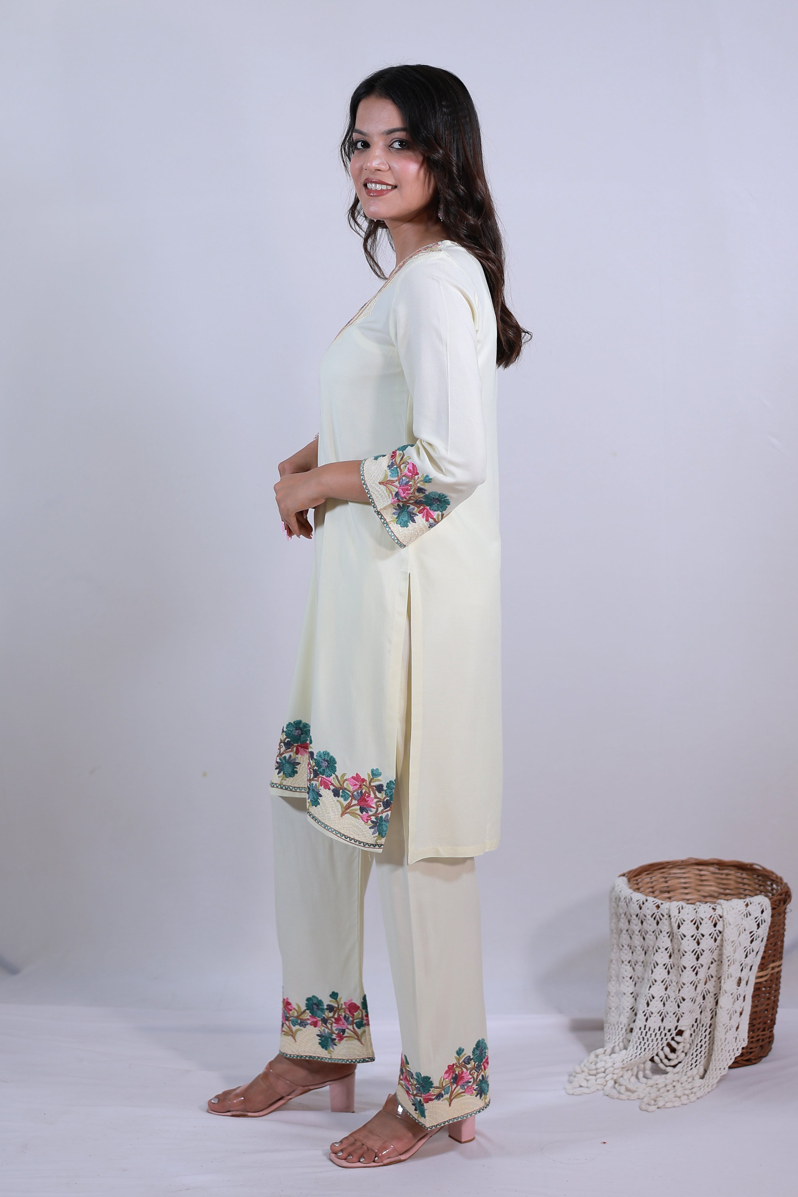 A woman wearing Simroz Bahaar-e-Gulmarg Kurta Set, Kashmiri Aari embroidery, Pastel Yellow – side view