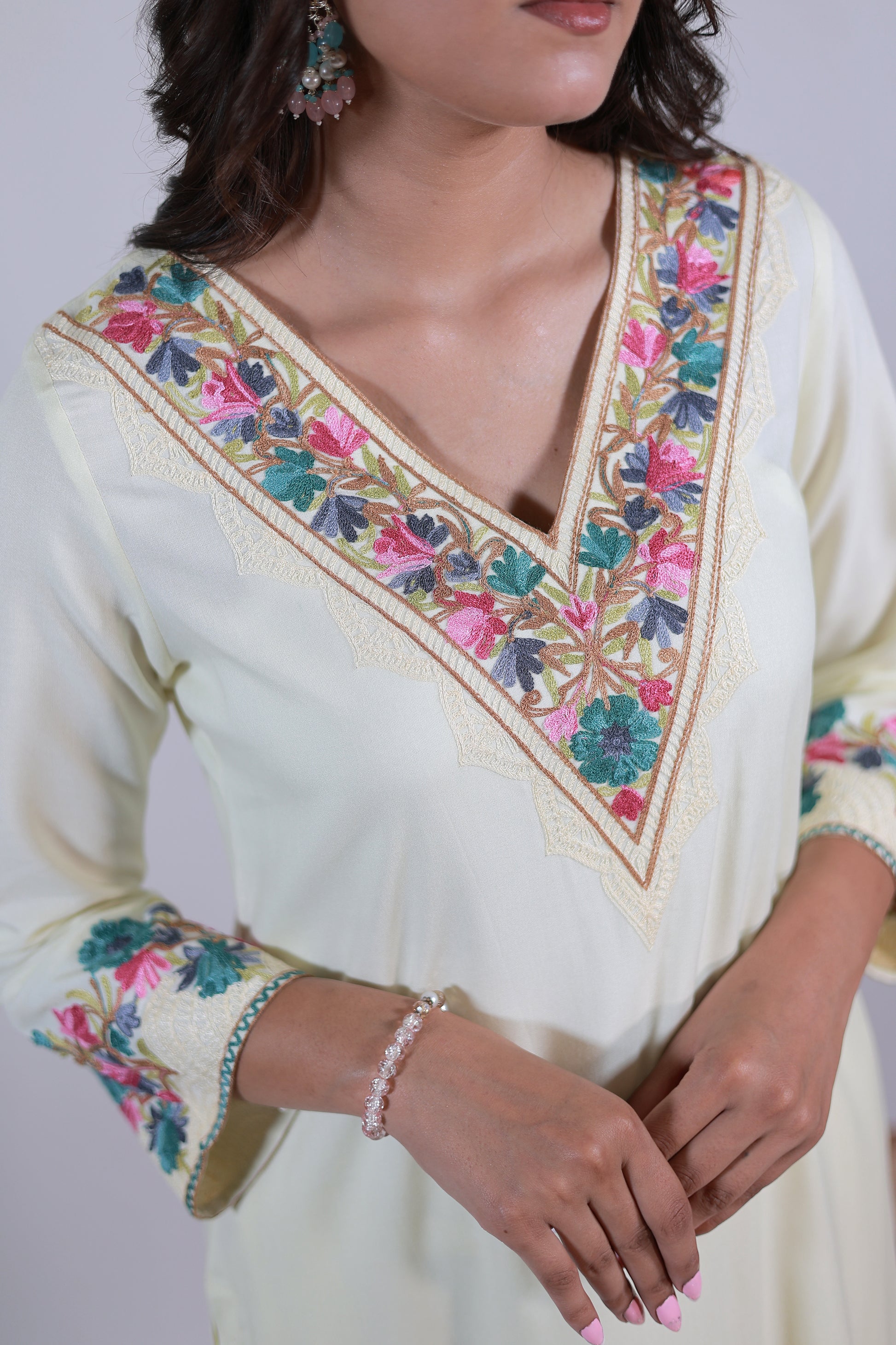 A woman wearing Simroz Bahaar-e-Gulmarg Kurta Set, Kashmiri Aari embroidery, Pastel Yellow – close-up view
