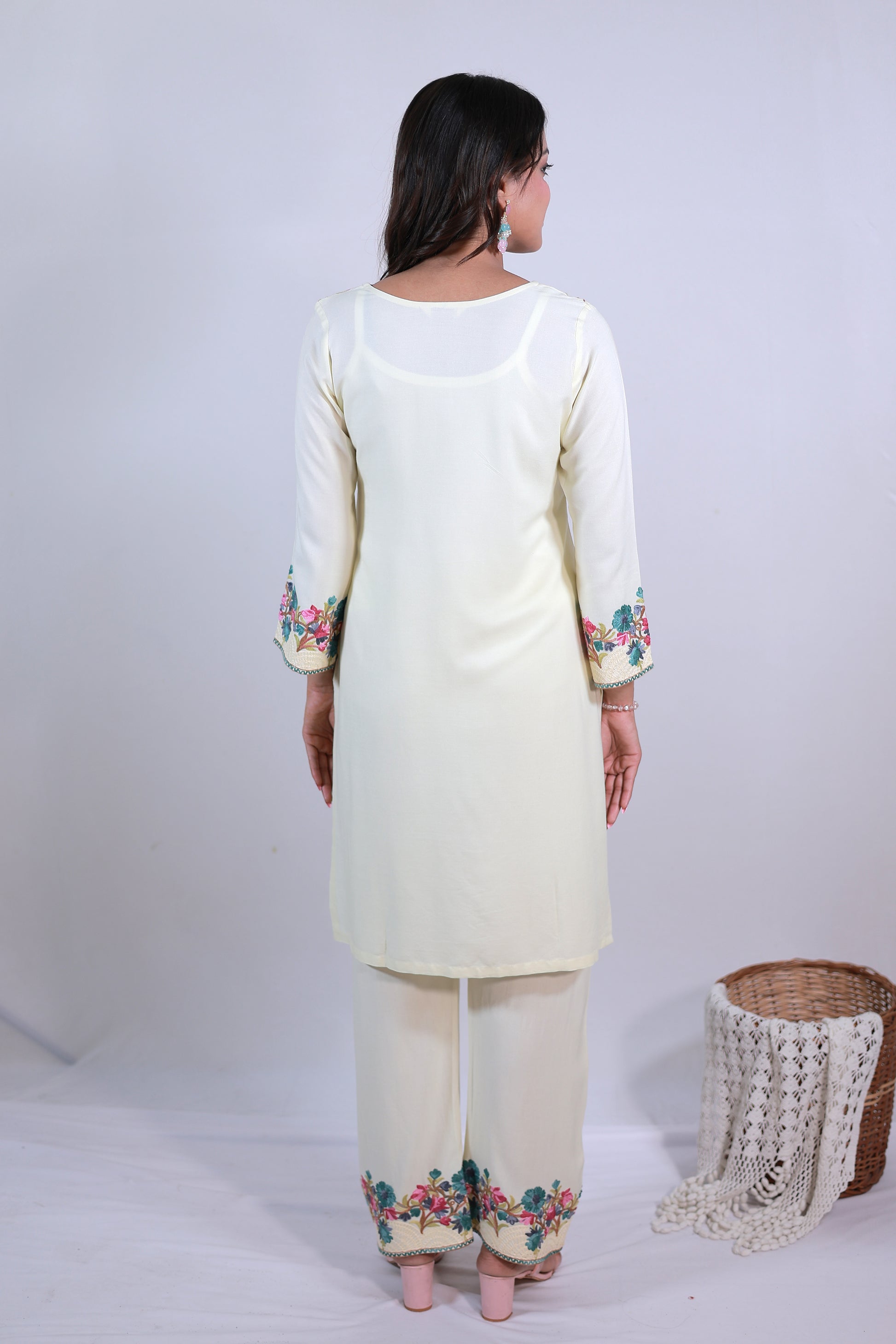A woman wearing Simroz Bahaar-e-Gulmarg Kurta Set, Kashmiri Aari embroidery, Pastel Yellow – back view