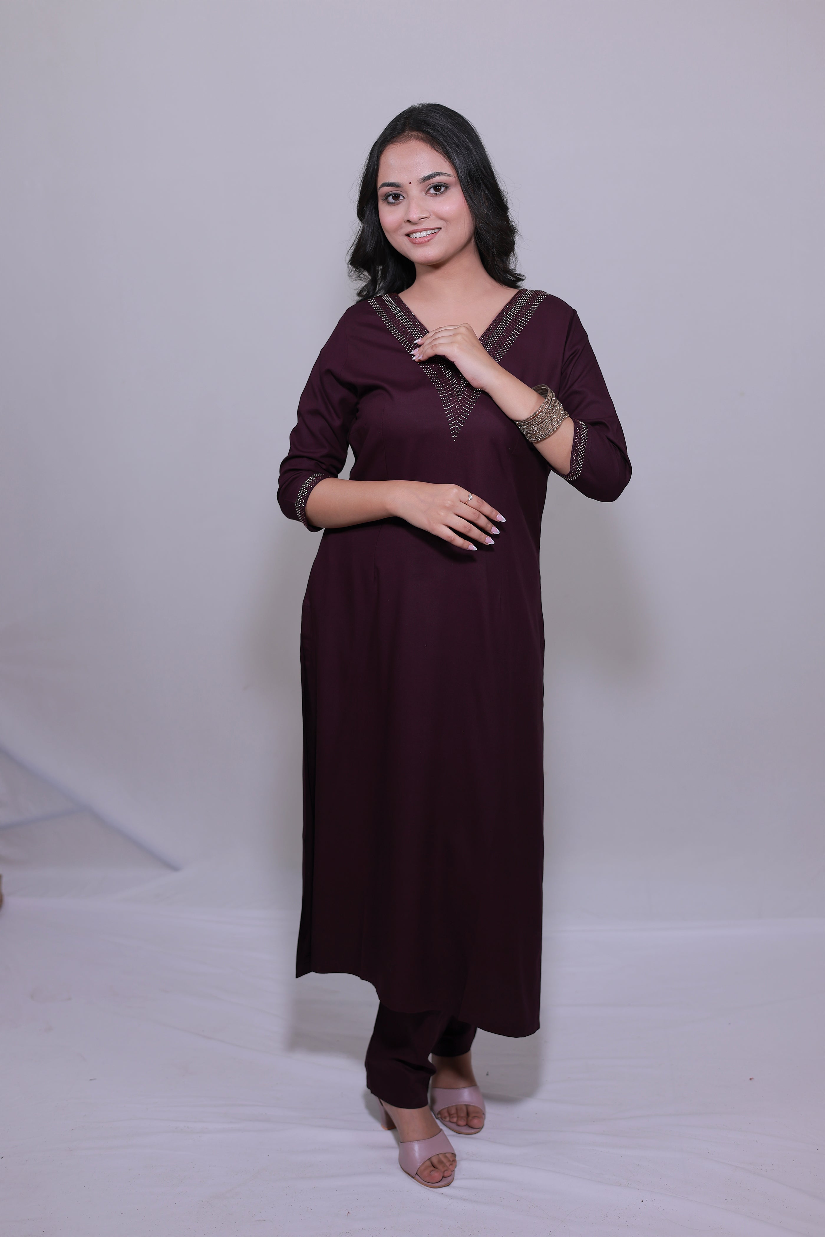Woman wearing Surayya wine rayon kurta set with Swarovski work by Simroz