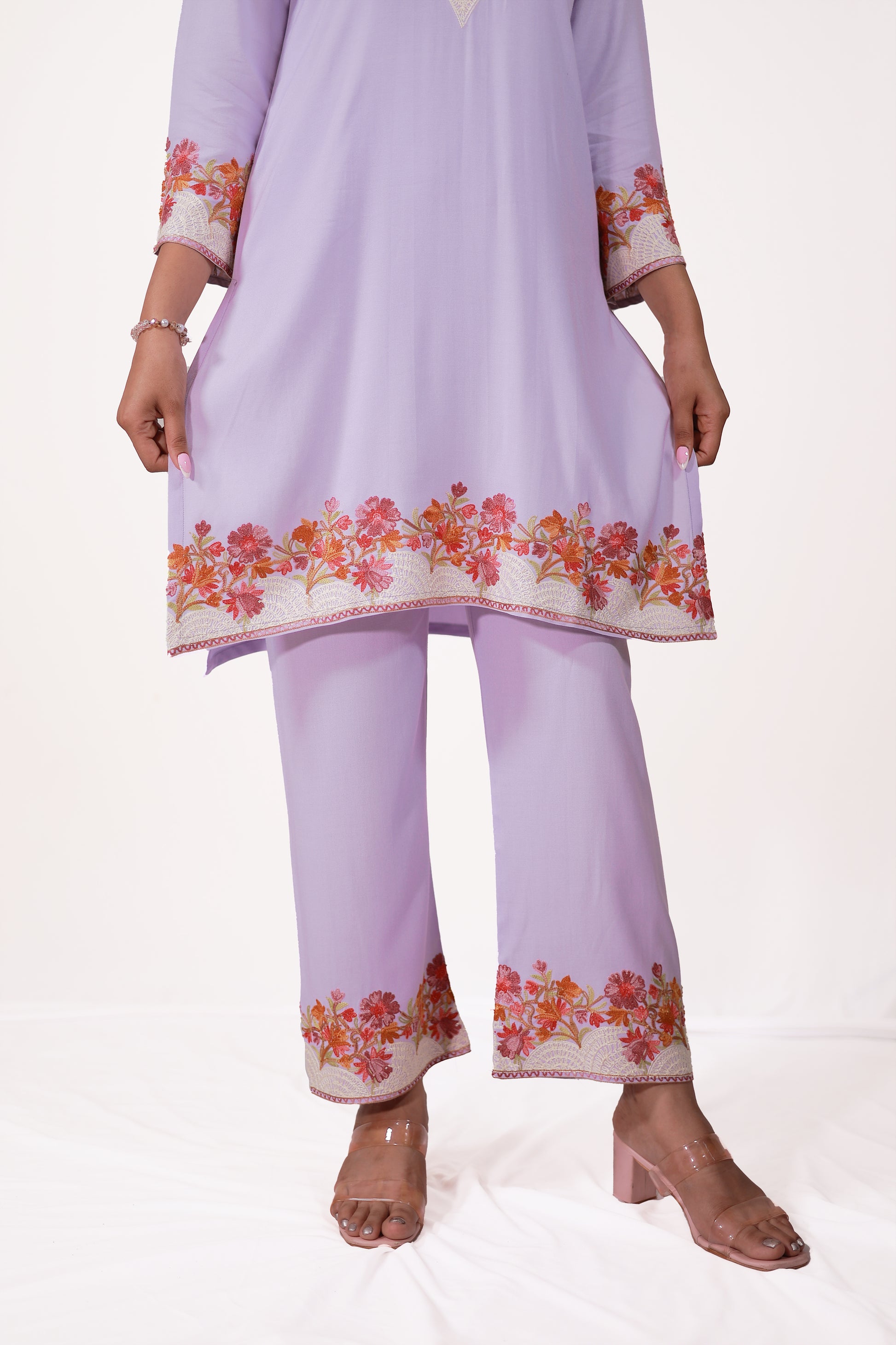 A woman wearing Simroz Bahaar-e-Gulmarg Kurta Set, Kashmiri Aari embroidery, Mauve color – front bottom view