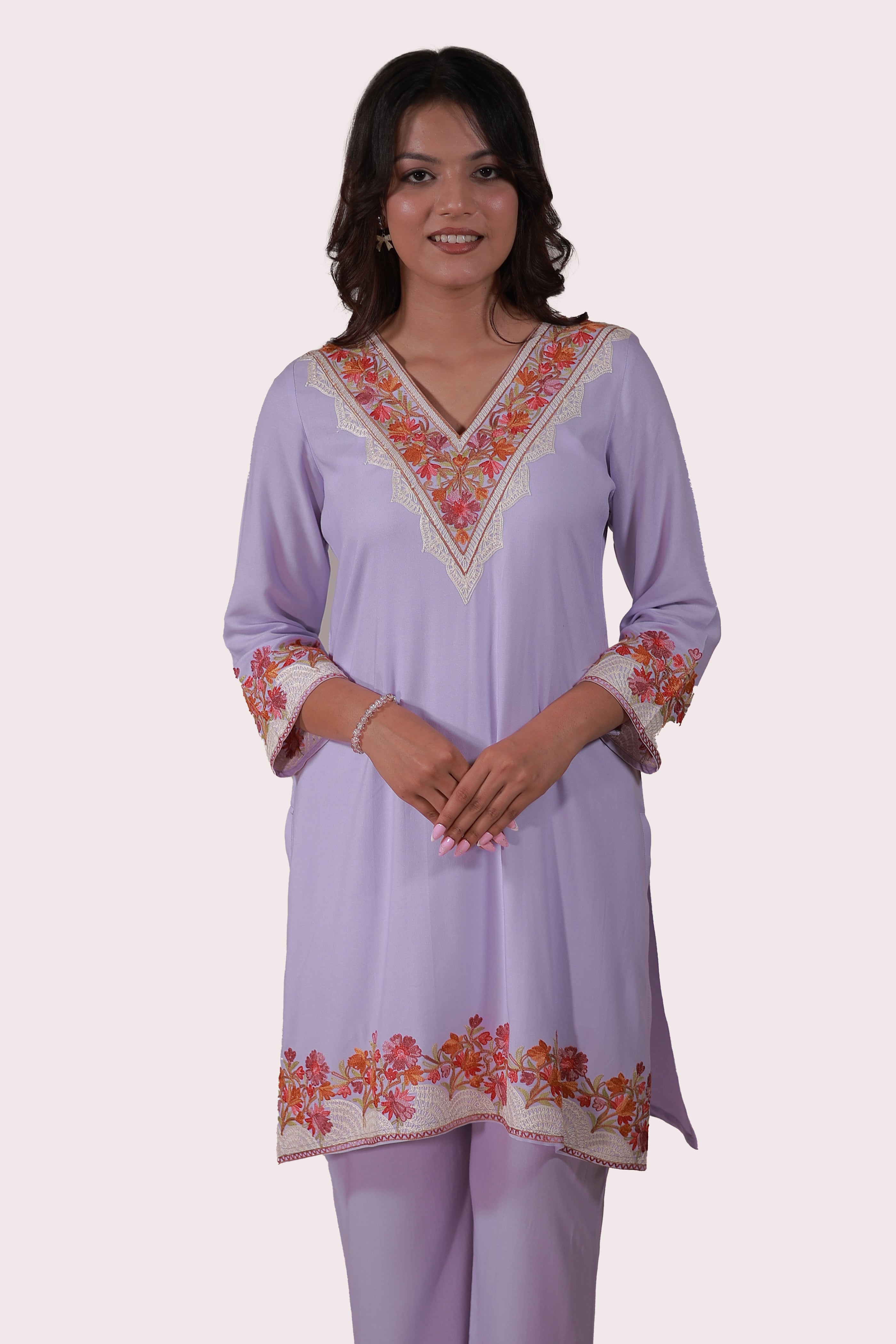 A woman wearing Simroz Bahaar-e-Gulmarg Kurta Set, Kashmiri Aari embroidery, Mauve color – front view