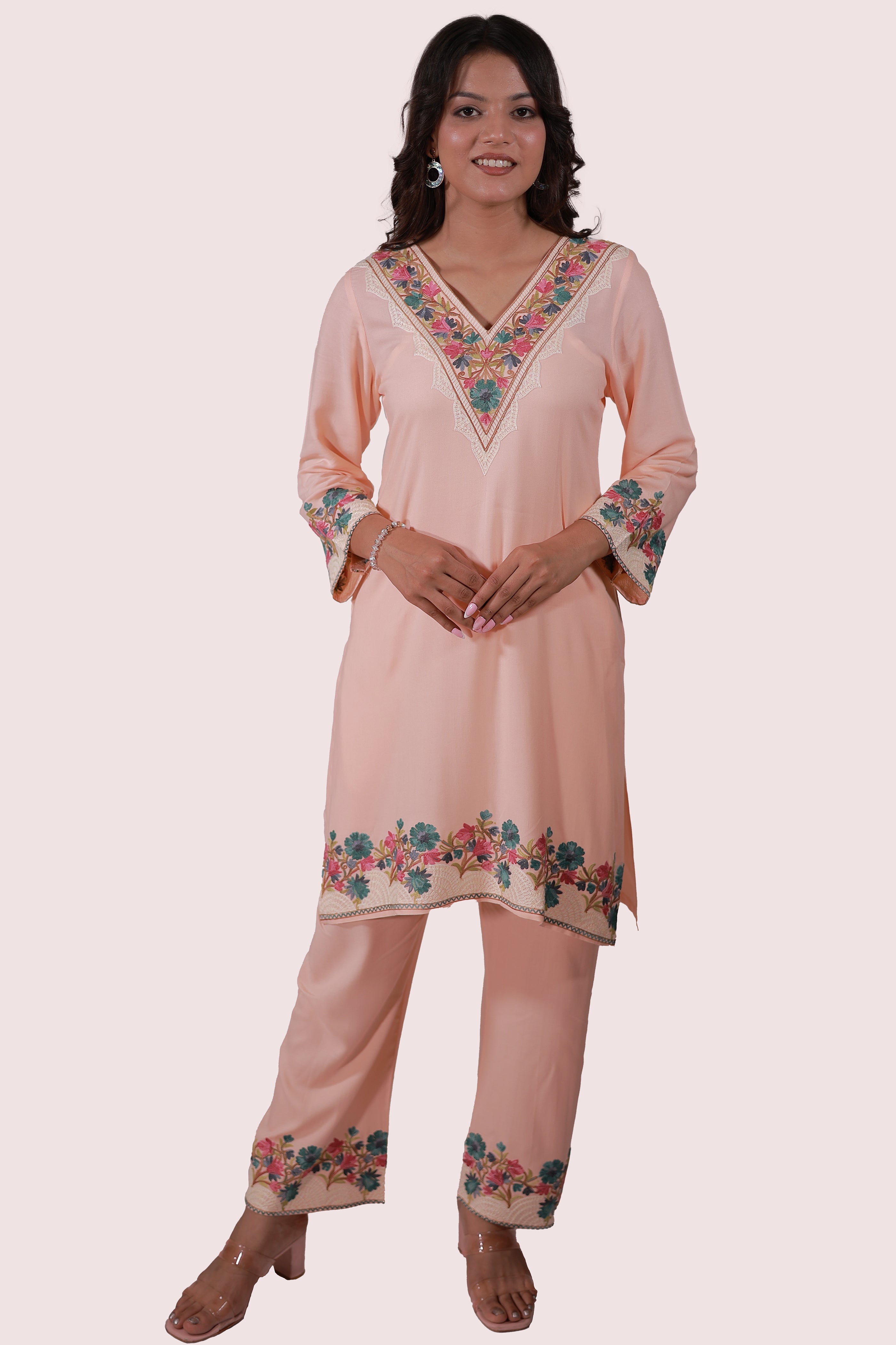 A woman wearing Simroz Bahaar-e-Gulmarg Kurta Set, Kashmiri Aari embroidery, Peach Orange – full front view