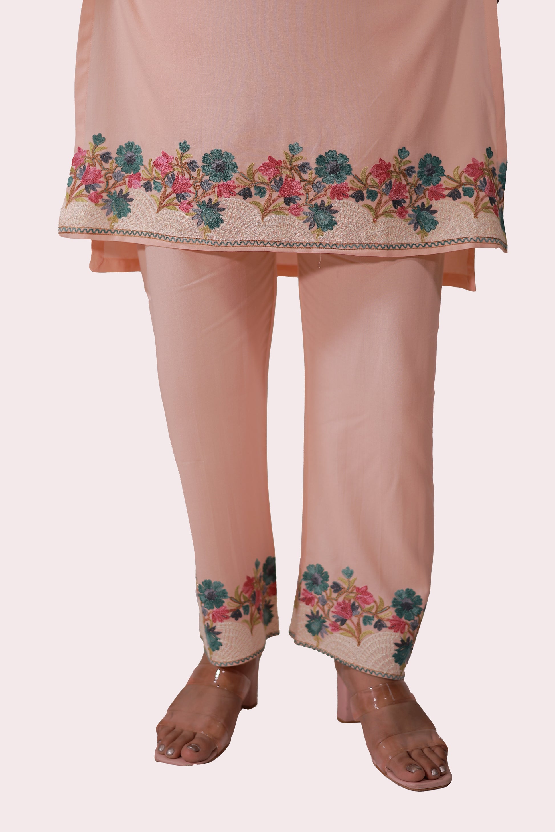 A woman wearing Simroz Bahaar-e-Gulmarg Kurta Set, Kashmiri Aari embroidery, Peach Orange – front bottom view